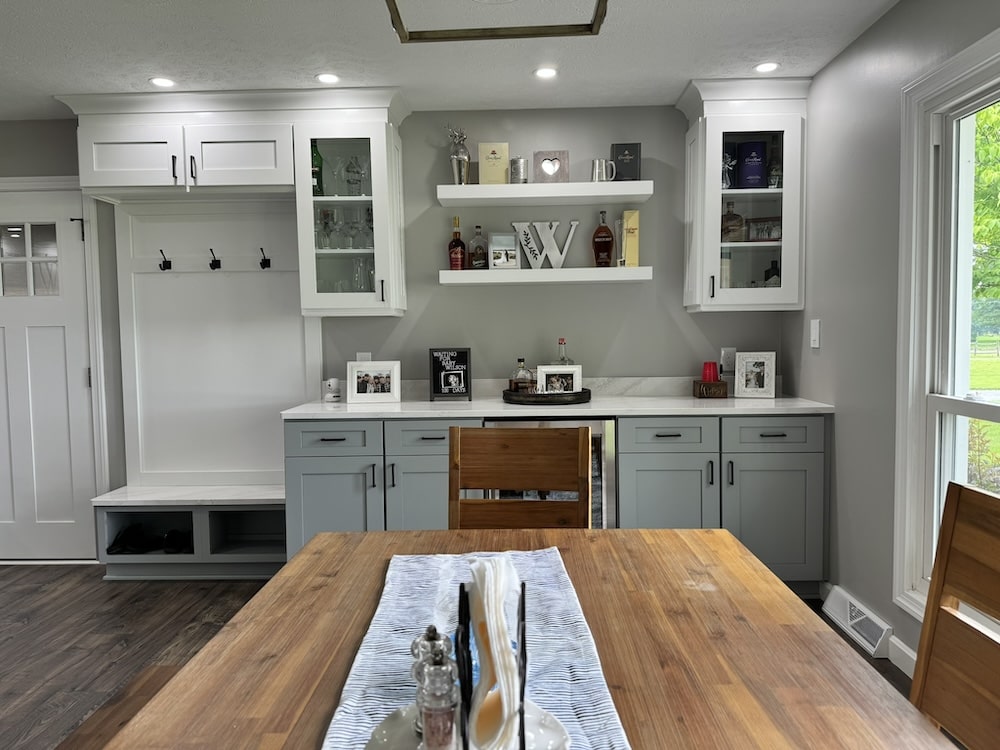 Bar cabinet photos with wine cooler and hooks to hang coats