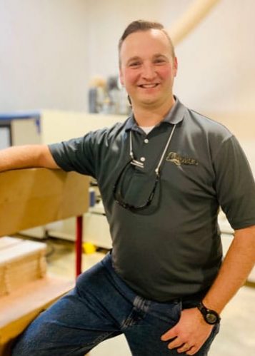 Tim Crowe smiling wearing Crowe's polo