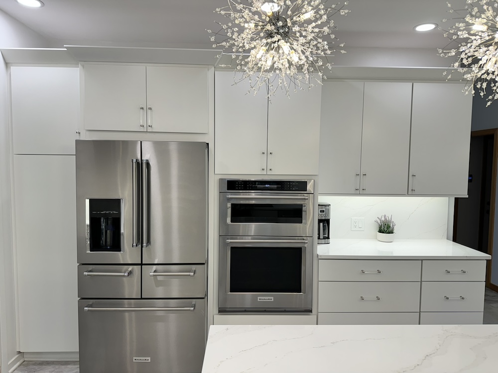 White kitchen with marble countertops from Crowe's Cabinets